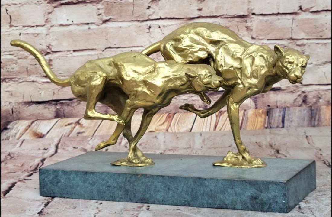 Golden Pursuit Bronze Sculpture - 7.5" x 15": Golden Pursuit Bronze Sculpture - 7.5" x 15". Inspired by and bearing the signature of artist Miguel Lopez, this dynamic bronze sculpture captures the raw speed and grace of two cheetahs runni