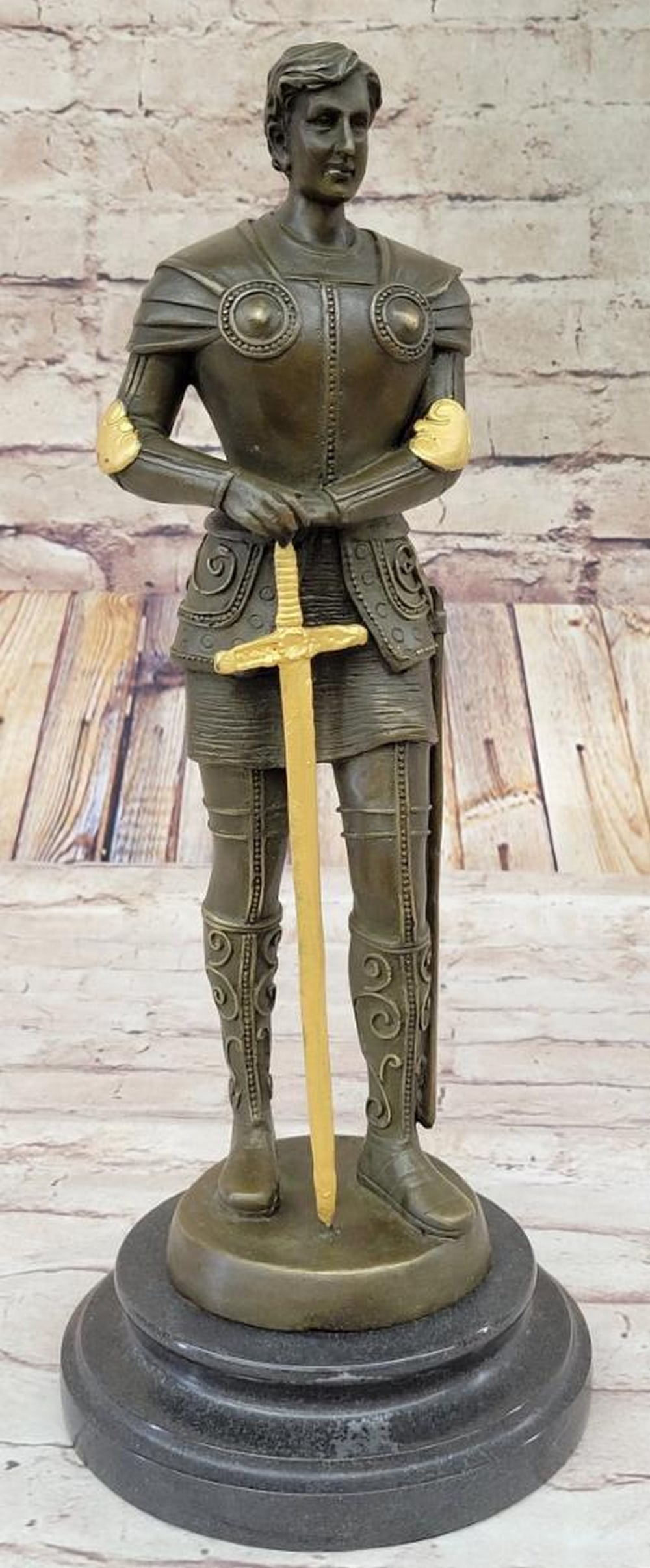 Knight in Armor Bronze Sculpture - 14" x 6": Knight in Armor Bronze Sculpture - 14" x 6" This striking bronze sculpture depicts a bold knight poised to seize his adversary’s castle, wielding a mighty sword in preparation for battle. Ev