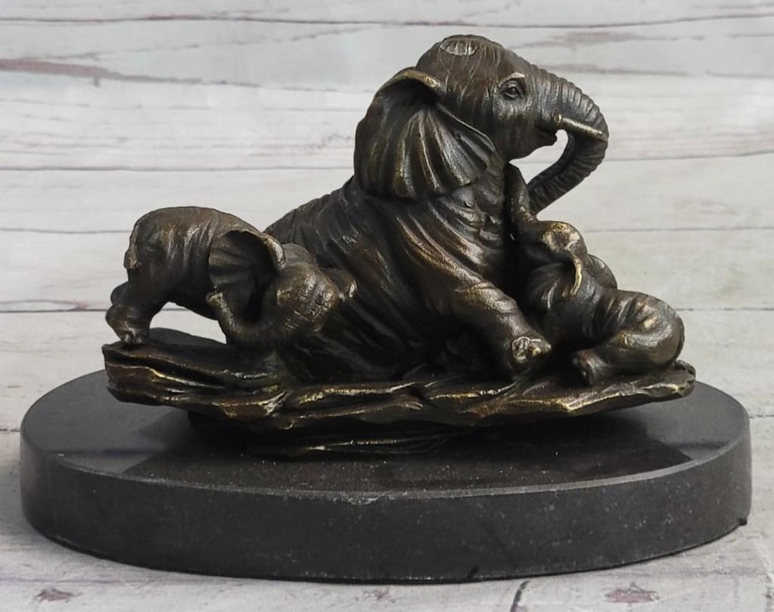 Enduring Bond Bronze Elephant Sculpture by Milo - 5 "x 6": Enduring Bond Bronze Elephant Sculpture by Milo - 5 "x 6" This touching bronze sculpture by Milo captures a tender moment between a mother elephant and her calf, symbolizing the strength and d