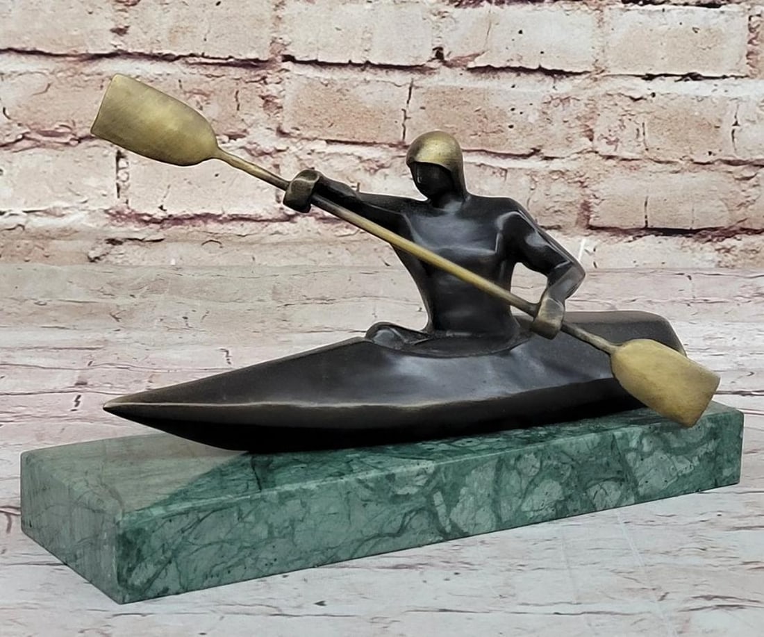 Canoeing Man Original Bronze Sculpture Signed by Mario Nick - 6" x 10": Canoeing Man Original Bronze Sculpture Signed by Mario Nick - 6" x 10" Immerse yourself in the beauty and grace of canoeing with our striking Canoeing Man Bronze Sculpture. Crafted with exquis