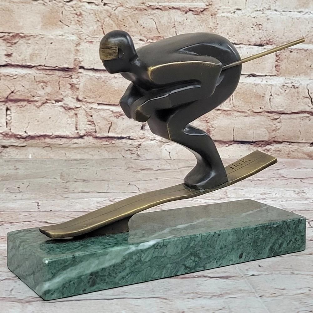 Confident Skier Original Bronze Sculpture Signed by Mario Nick - 7" x 8.5": Confident Skier Original Bronze Sculpture Signed by Mario Nick - 7" x 8.5" Experience the thrill of the slopes with our Confident Skier Bronze Sculpture by Mario Nick. Skillfully navigating th