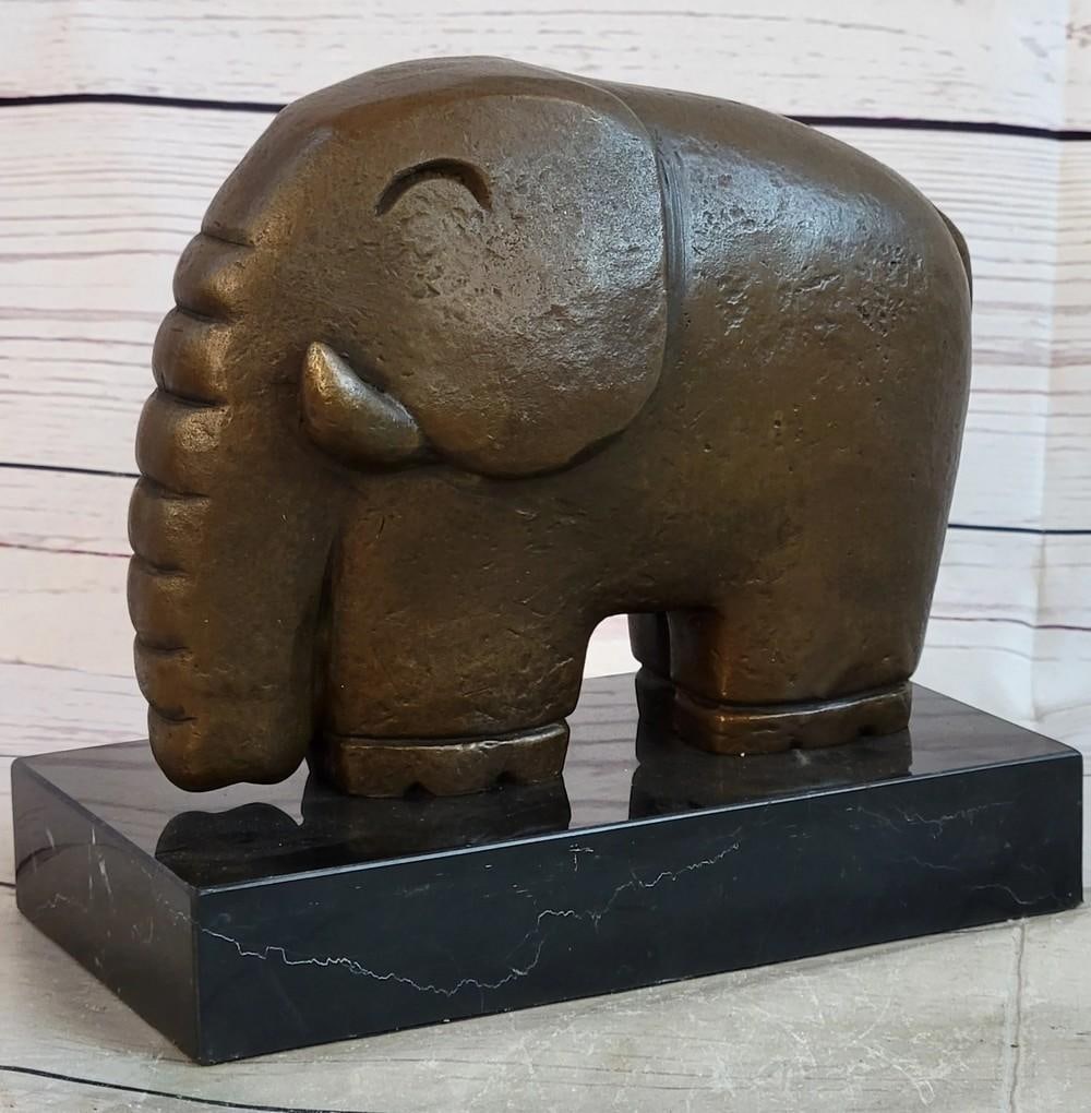 Abstract Elephant Modern Art Inspired Bronze - 6.5" x 7": Abstract Elephant Modern Art Inspired Bronze - 6.5" x 7" This modern art piece captures the essence of an elephant through abstract bronze forms. Its smooth, flowing lines and simplified shape