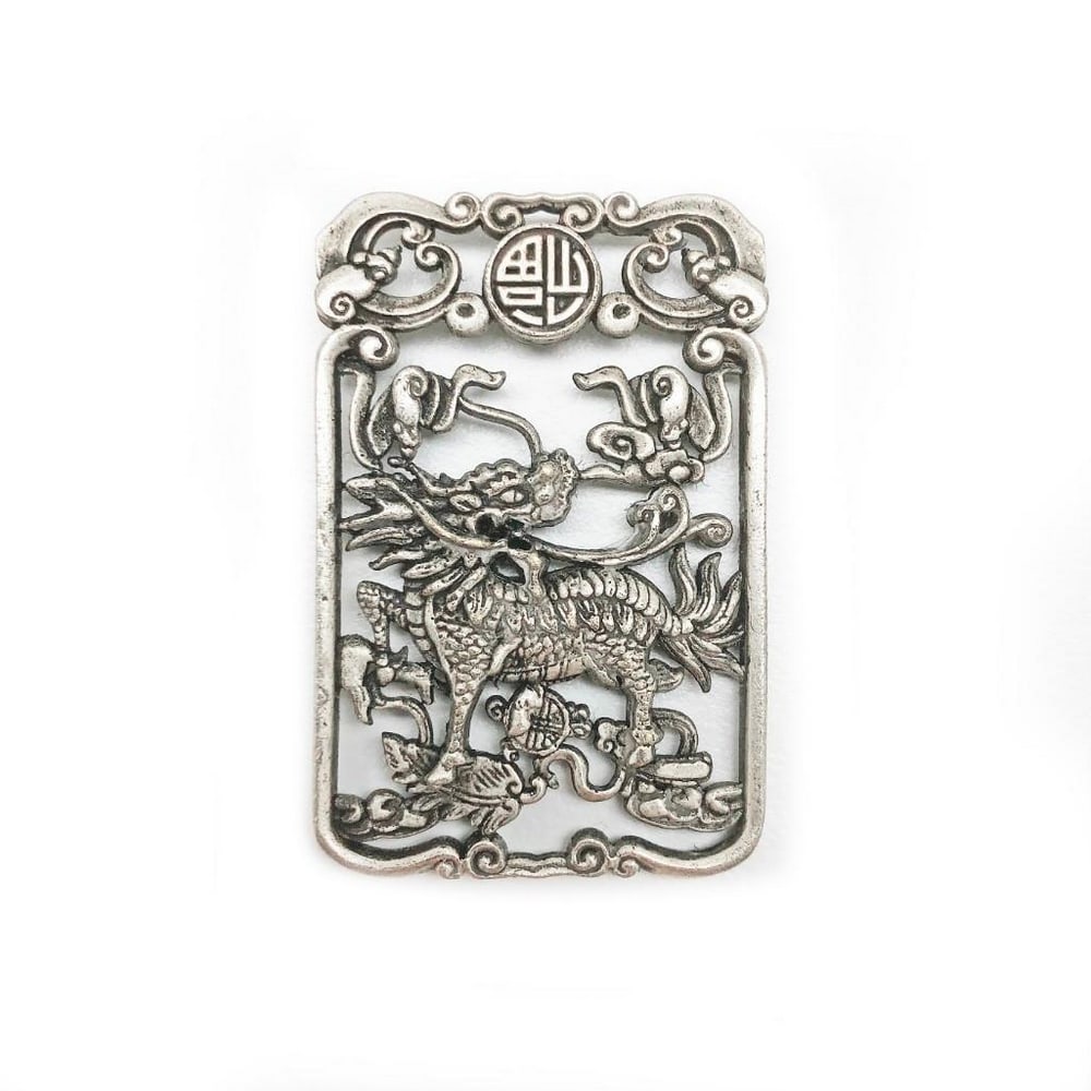 Tibetan Silver Hand Carved Kirin Pendant: An Exquisite Tibetan Silver Hand Carved Kirin Pendant. This stunning Tibetan silver hand-carved Kirin pendant beautifully captures the essence of this mythical creature, often regarded as a symbol of 