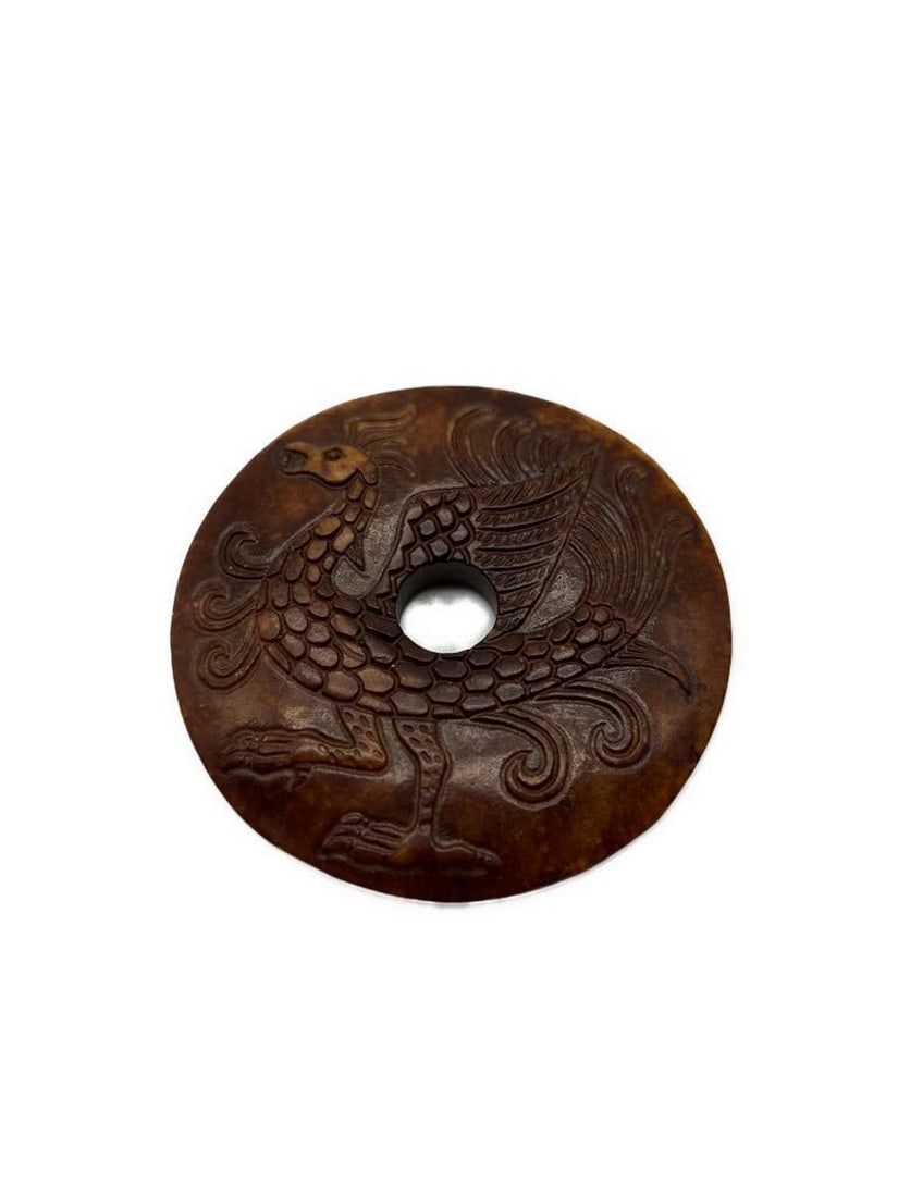 Hand Carved Jade Hongshan Culture Phoenix Medallion: Hand Carved Jade Hongshan Culture Phoenix Medallion A exquisite and culturally rich piece of art that showcases the skilled craftsmanship and historical significance of the Hongshan cultur