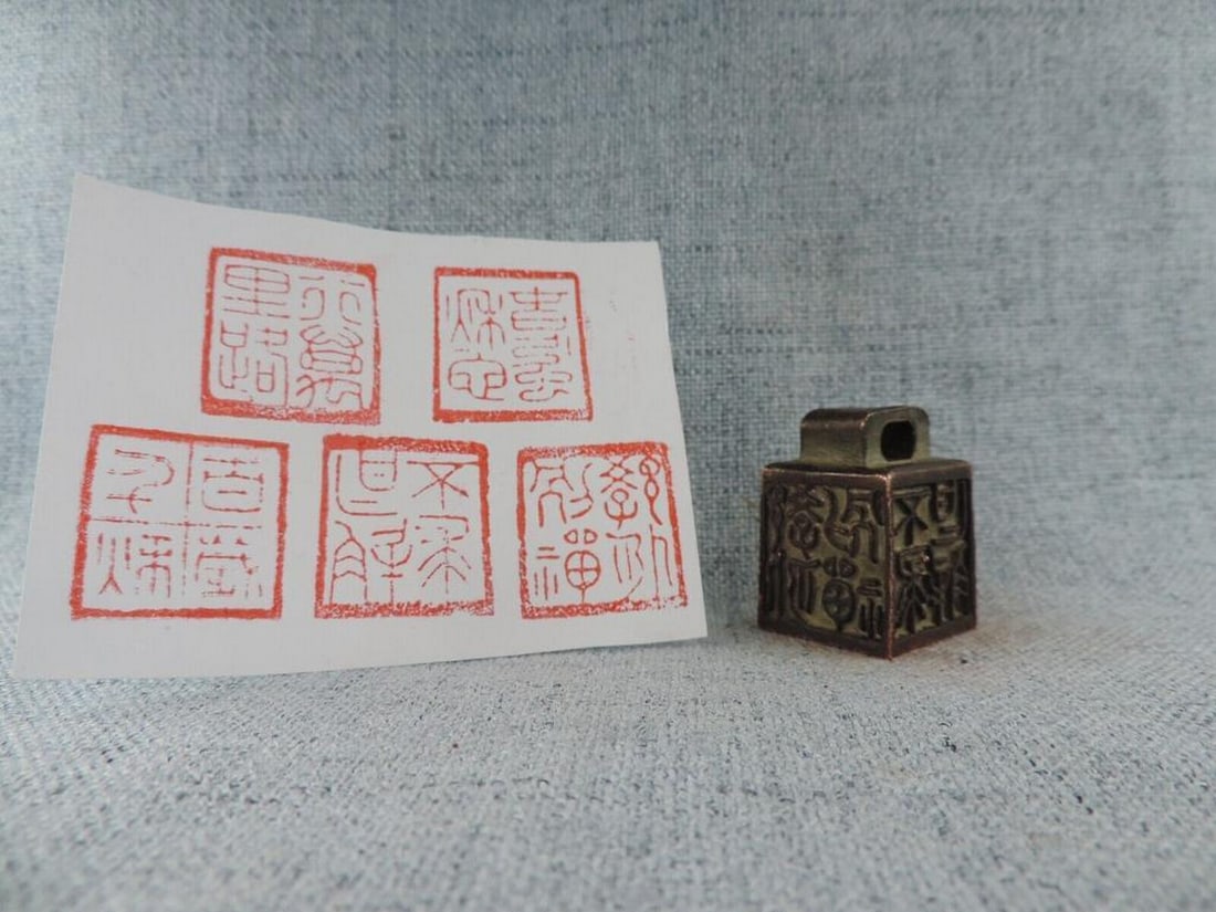 Vintage Chinese 5-Sided Bronze Kanji Wax Stamp: Vintage Chinese 5-Sided Bronze Kanji Wax Stamp A captivating piece of traditional Chinese craftsmanship. Made from dark material, possibly wood or stone, it features intricate carvings on its sides an