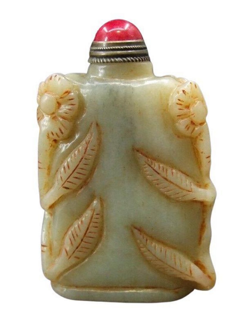 Handmade Chinese Jade Snuff Bottle With Floral Accents & Red Stopper: Handmade Chinese Jade Snuff Bottle With Floral Accents & Red Stopper This exquisite handmade Chinese snuff bottle is crafted from natural jade and features delicate floral accents, showcasing intr