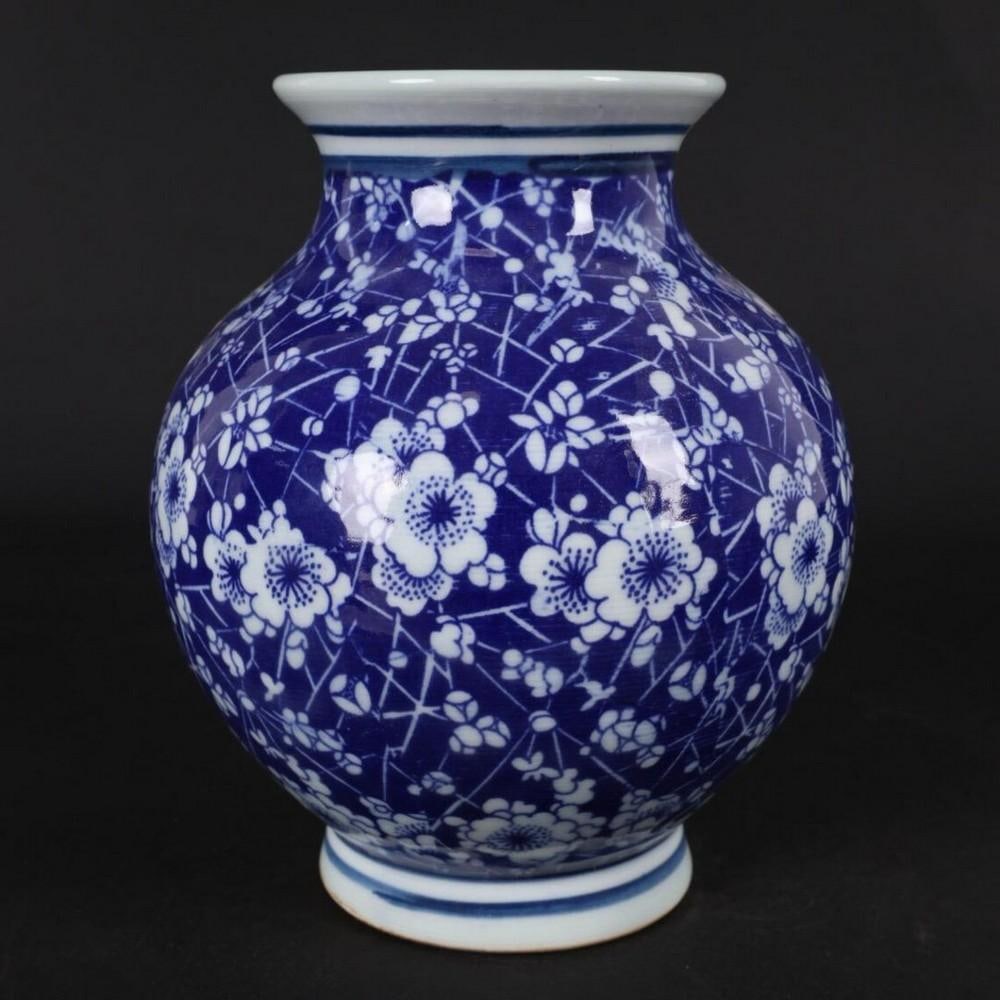 Chinese Antique Hand-Painted Blue and White Ice Plum Pattern Pomegranate Vase: Chinese Antique Hand-Painted Blue and White Ice Plum Pattern Pomegranate Vase This rare Chinese antique pomegranate-shaped vase features an exquisite hand-painted blue and white ice plum pattern, symb