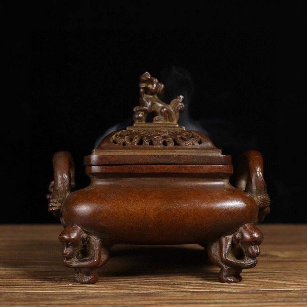 Rare Pure Copper Tripod Incense Burner with Dragon Ears and Monkey Feet: Rare Pure Copper Tripod Incense Burner with Dragon Ears and Monkey Feet This rare and exquisite Chinese antique incense burner is entirely handcrafted from pure copper, showcasing a harmonious blend o