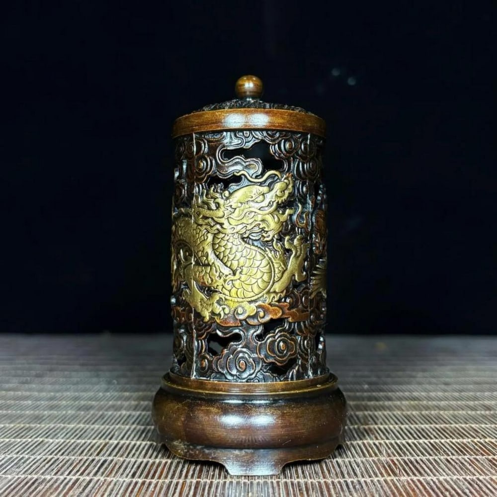 Chinese Antique Handmade Copper Relief Hollow Dragon and Phoenix Incense Burner: Chinese Antique Handmade Copper Relief Hollow Dragon and Phoenix Incense Burner A rare and exquisite Chinese antique incense burner, meticulously handcrafted from copper. Featuring intricate relief de