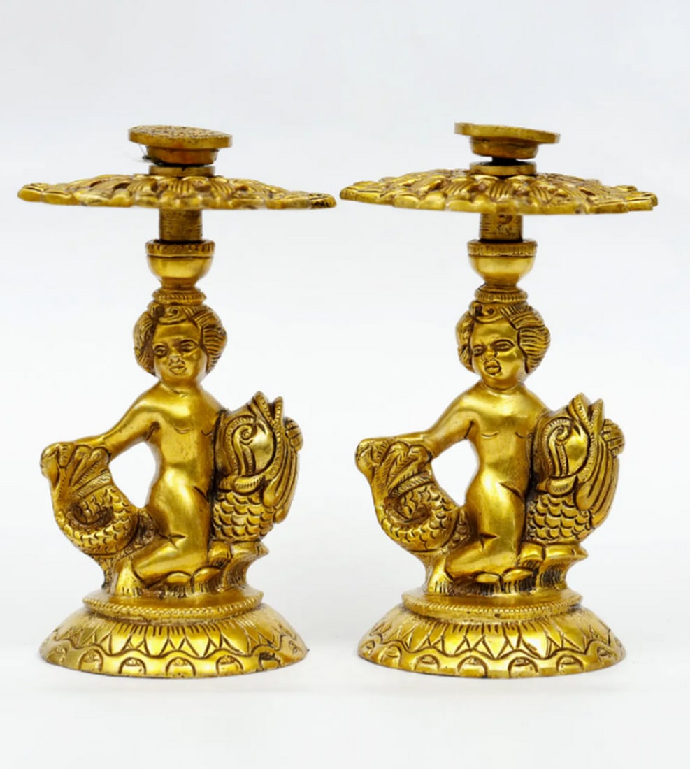 Brass Pair of Angels Candle Holders – 6": Brass Pair of Angels Candle Holders – 6" A pair of 6.5-inch brass candle holders designed as elegant angels. Each figure features simple, refined detailing and supports a small platform for a ca