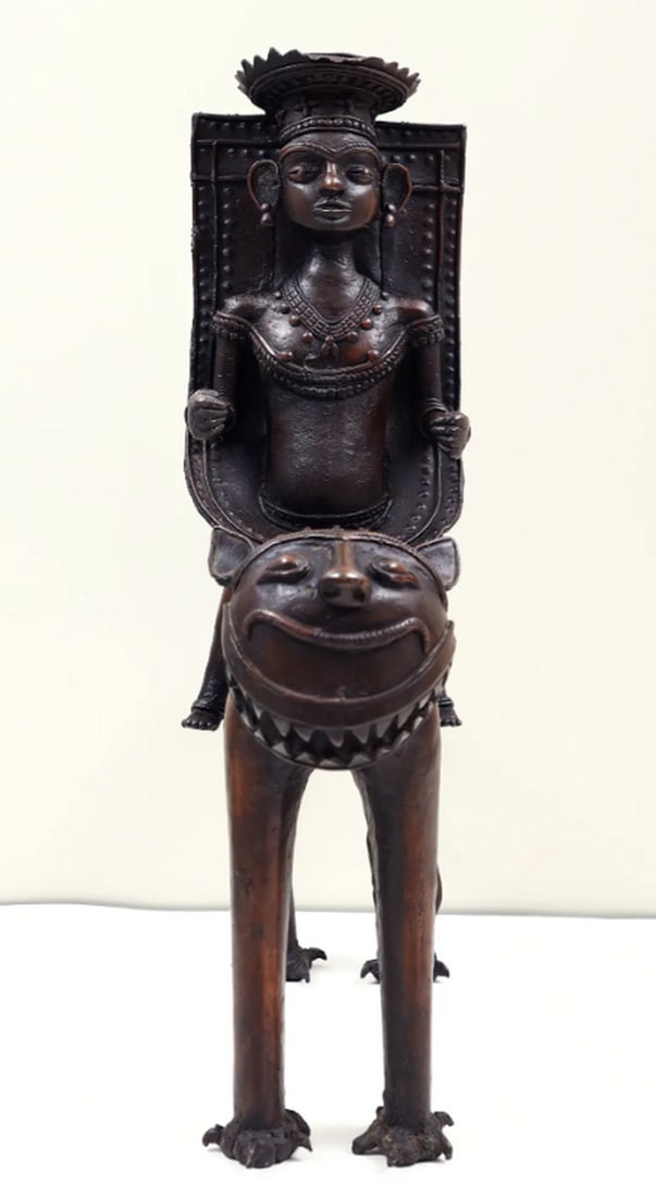 17" Dhokra Art Tribal Man Sitting on Lion: 17" Dhokra Art Tribal Man Sitting on Lion Sculpture made from brass using the traditional lost-wax casting technique. The piece depicts a tribal man seated on a lion, featuring detailed ornamentat
