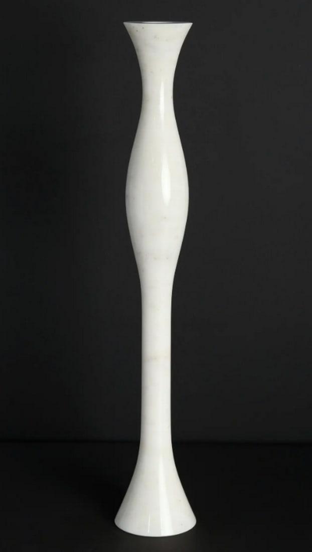 White Marble Candle Stand – 24": White Marble Candle Stand – 24" A 24-inch candle stand crafted from polished white marble. Featuring a slender, gracefully curved silhouette with a flared base for stability, this piece combines