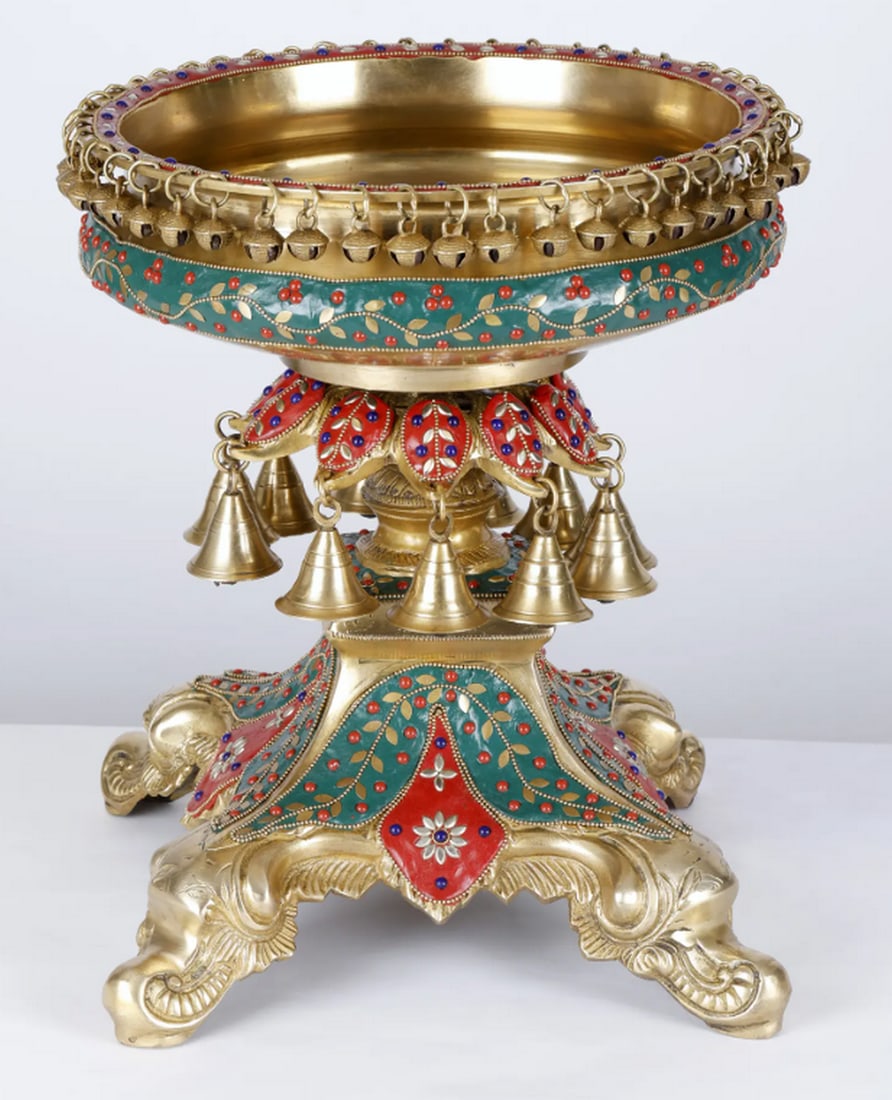 14" Designer Urli Bowl with Dangling Bells and Ghungroos: 14" Designer Urli Bowl with Dangling Bells and Ghungroos Brass urli with intricate inlay work, featuring dangling bells and ghungroos. Traditionally used in front of pooja rooms, it serves as both