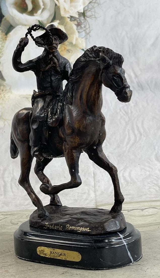 Western Cowboy on Horse Bronze Sculpture: Western Cowboy on Horse Bronze Sculpture A seasoned cowboy courageously rides his wild horse. He is bucked by his uncontrollable stallion but his grip on the reins never break. His body rolls with eve