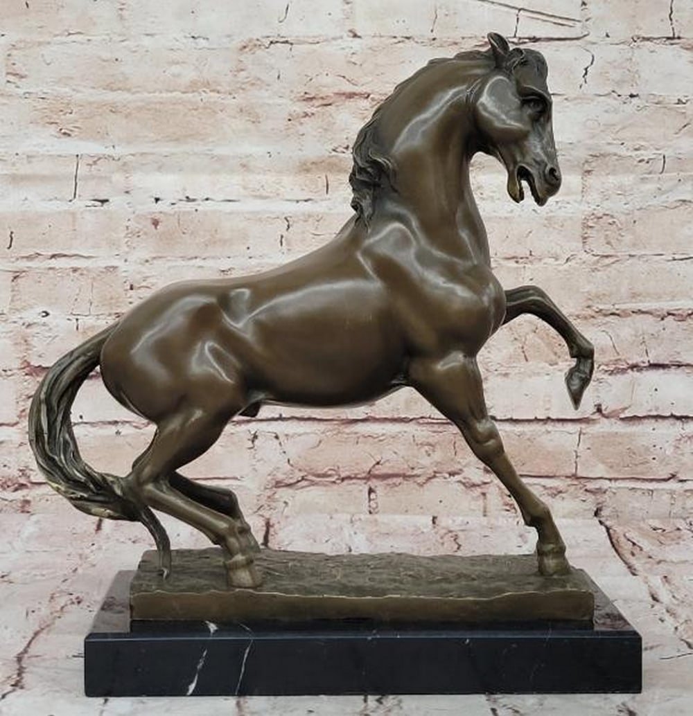 Untamed Power: Bronze Rearing Horse Sculpture: Untamed Power: Bronze Rearing Horse Sculpture Capturing a moment of pure energy and motion, this bronze sculpture features a horse rearing high on its hind legs, embodying strength, spirit, and untame