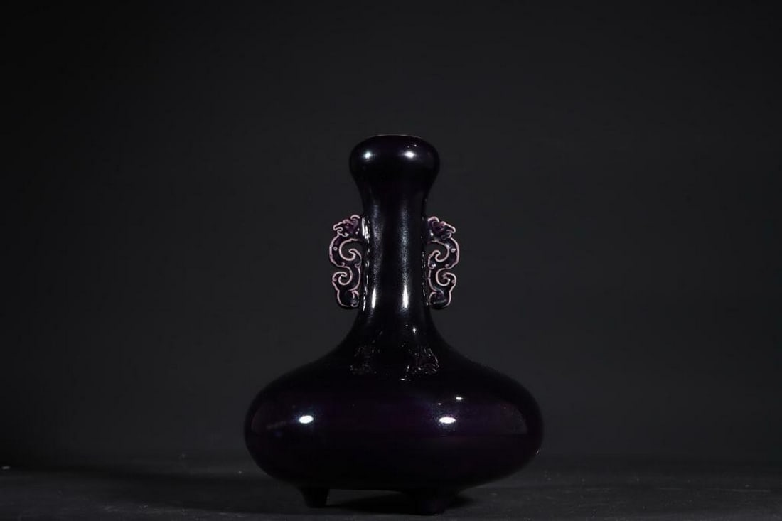 Inspired Qianlong Eggplant-Purple Dragon-Eared Tripod Vase: Inspired Qianlong Eggplant-Purple Dragon-Eared Tripod Vase Inspired by the opulent artistry of the Qing Dynasty’s Qianlong period, this eggplant-skin purple glazed vase radiates regal sophistication