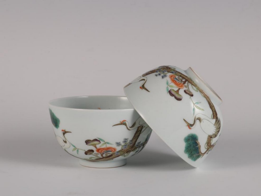 Pair of Qing Dynasty Qianlong Inspired Famille Rose “Pine and Crane Prolonging?? Cups: Pair of Qing Dynasty Qianlong Inspired Famille Rose “Pine and Crane Prolonging” Cups An inspired pair of famille rose porcelain cups in the style of the Qianlong period (1736–1795) of the