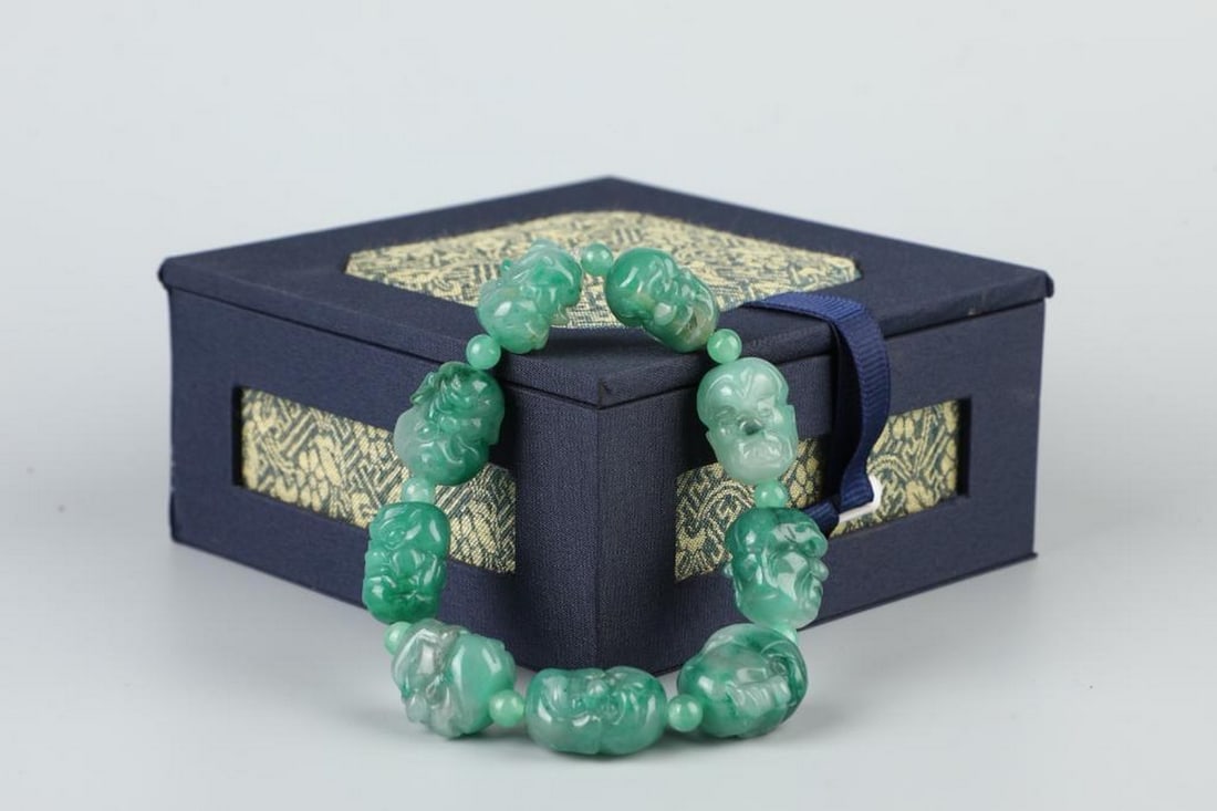 Timeless Elegance: Handcrafted Jade Bracelet: Timeless Elegance: Handcrafted Jade Bracelet A stunning handcrafted jade bracelet weighing 75 grams, celebrated for its smooth texture and natural sheen. This piece embodies traditional symbolism of