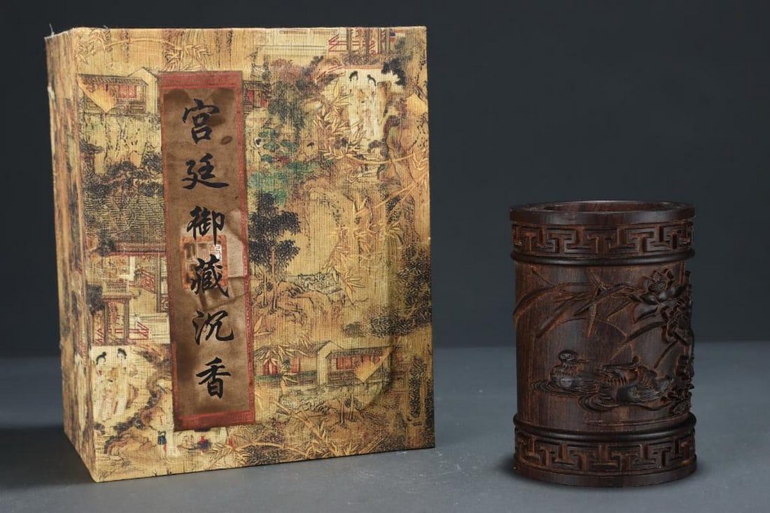 Inspired Palace Antique Agarwood Pen Holder with Mandarin Duck Engraving: Inspired Palace Antique Agarwood Pen Holder with Mandarin Duck Engraving This elegant pen holder inspired from the old palace agarwood collection features intricate engravings of mandarin ducks playin