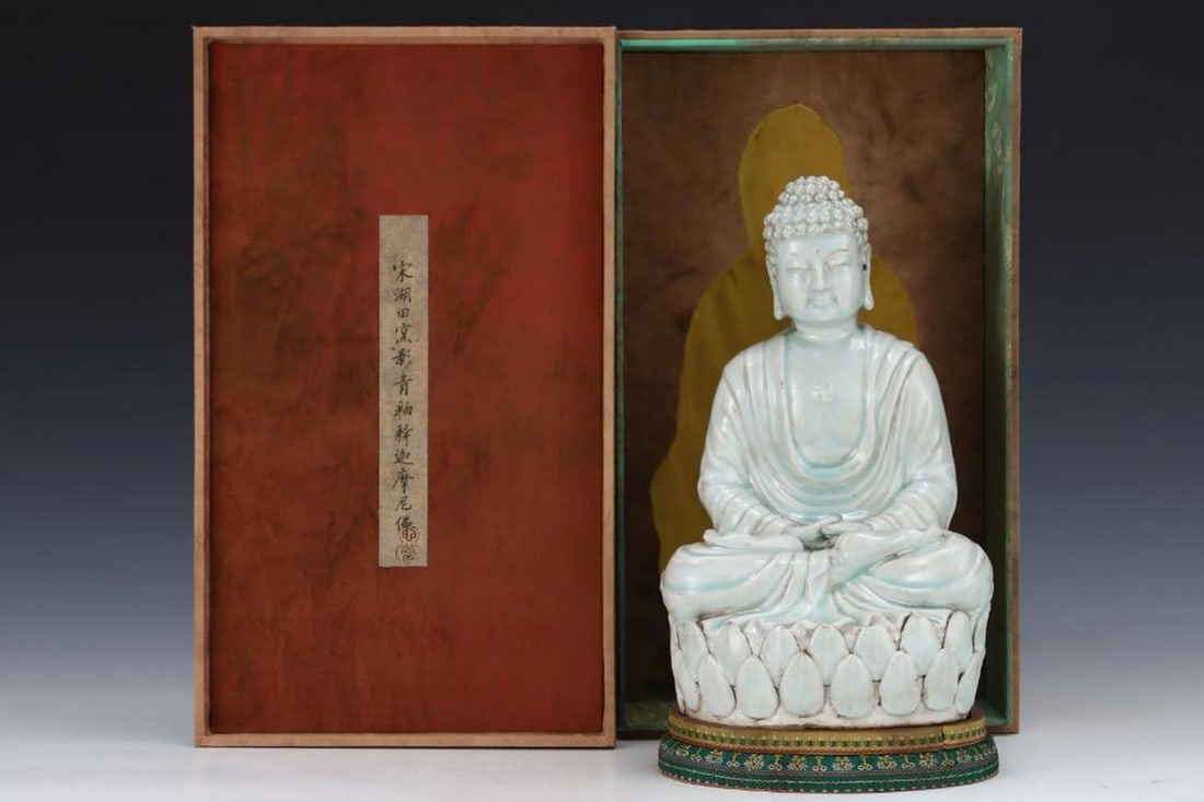 Inspired Antique Song Hutian Kiln Shakyamuni Buddha Statue: Inspired Antique Song Hutian Kiln Shakyamuni Buddha Statue A serene Shakyamuni Buddha statue inspired from the old Song Hutian kiln collection, showcasing delicate craftsmanship and spiritual grace. T
