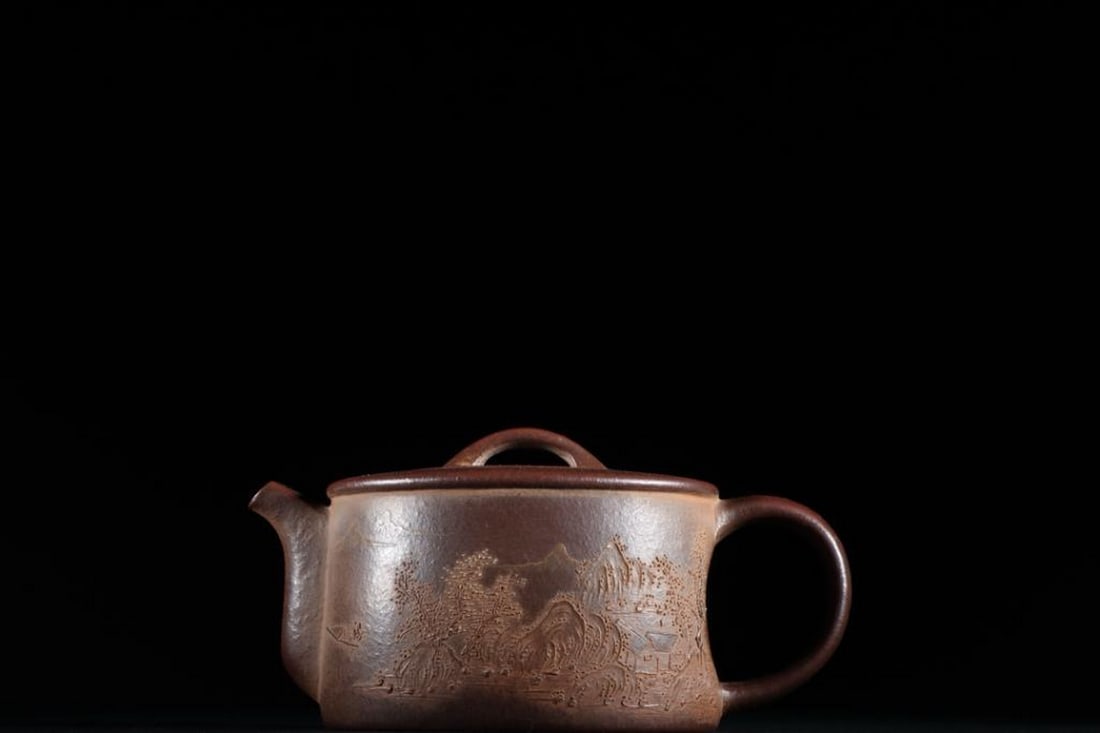 Zisha Teapot Inspired by Yang Jichu Oval Form with Landscape Design: Zisha Teapot Inspired by Yang Jichu Oval Form with Landscape Design A finely crafted oval-shaped Yixing Zisha teapot inspired by artist Yang Jichu, featuring an elegant landscape scene. The natural sc