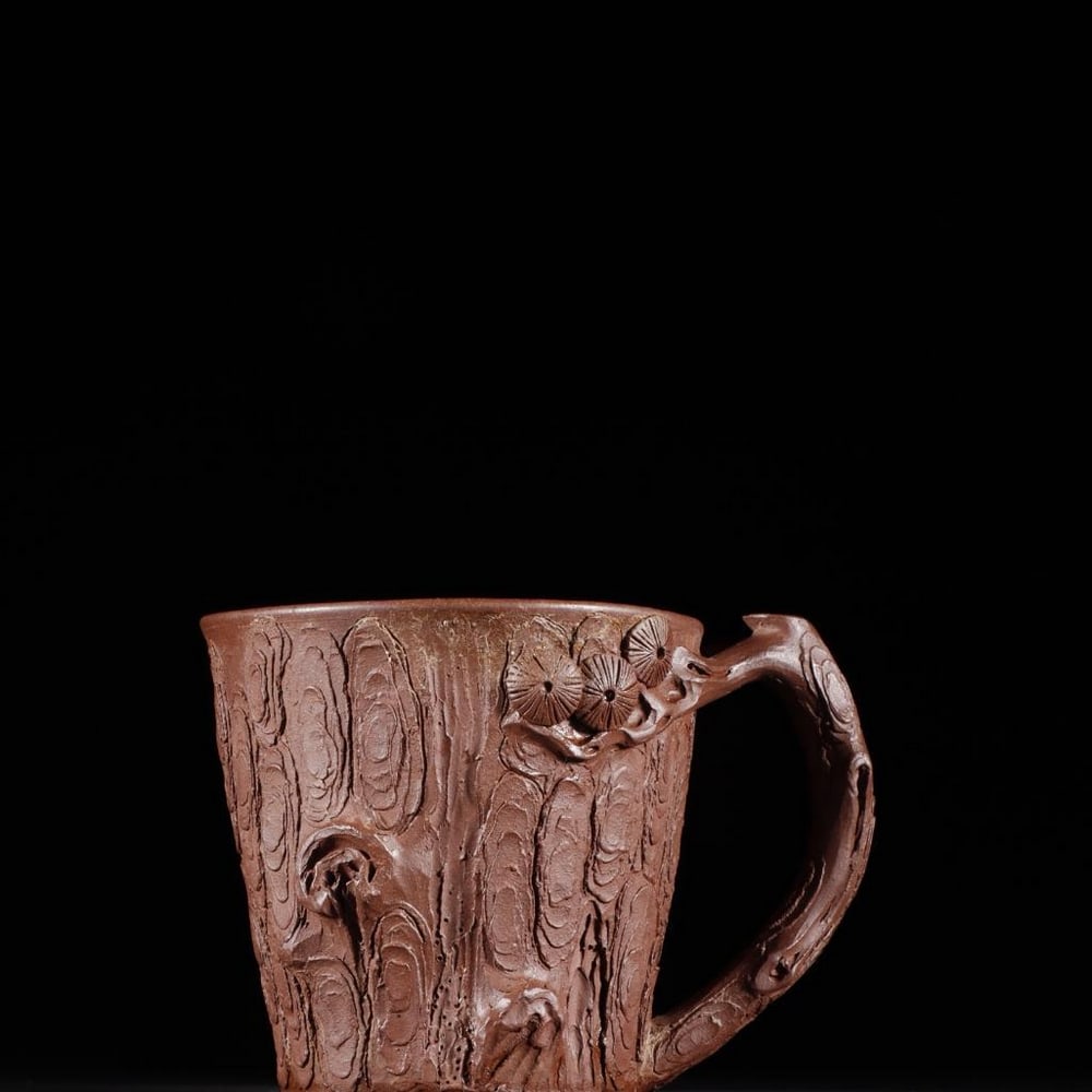 Exquisite Zisha Pine-Section Style Teacup: Exquisite Zisha Pine-Section Style Teacup A beautifully crafted Yixing Zisha teacup modeled after a natural pine branch section, featuring finely detailed bark texture and naturalistic contours. This 