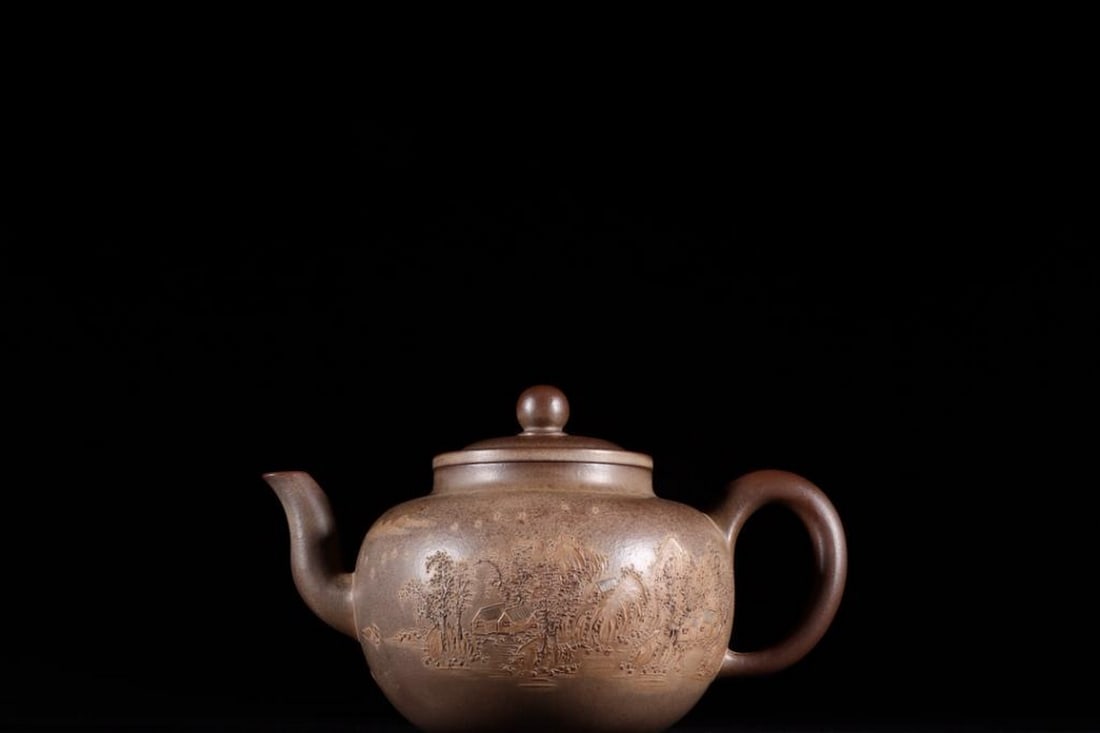 Zisha Teapot with Clay-Painted Landscape: Qing De Tang Mark: Zisha Teapot with Clay-Painted Landscape: Qing De Tang Mark A finely crafted Yixing Zisha teapot featuring a painted clay slip landscape scene in traditional literati style. Marked “Qing De Tang&rdq