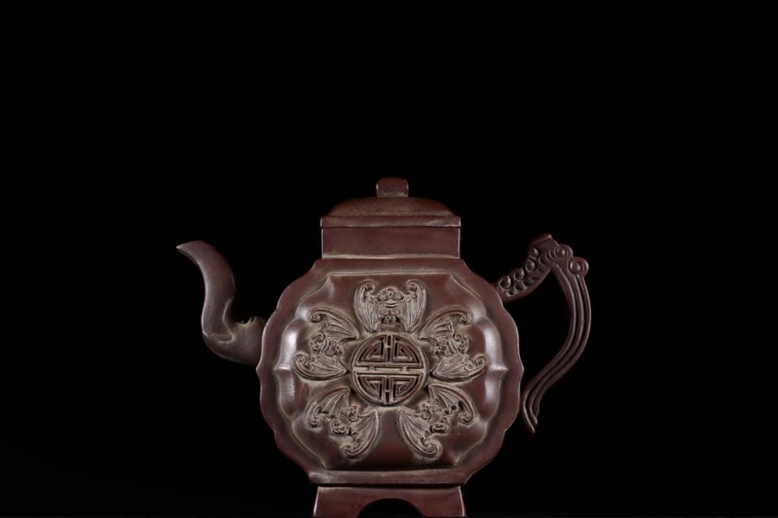 Zisha Teapot Inspired by Qian Hongwen Five Blessings Supporting Longevity Quartet Form: Zisha Teapot Inspired by Qian Hongwen Five Blessings Supporting Longevity Quartet Form A square-form Yixing Zisha teapot inspired by Qian Hongwen, featuring applied relief of five bats encircling the 