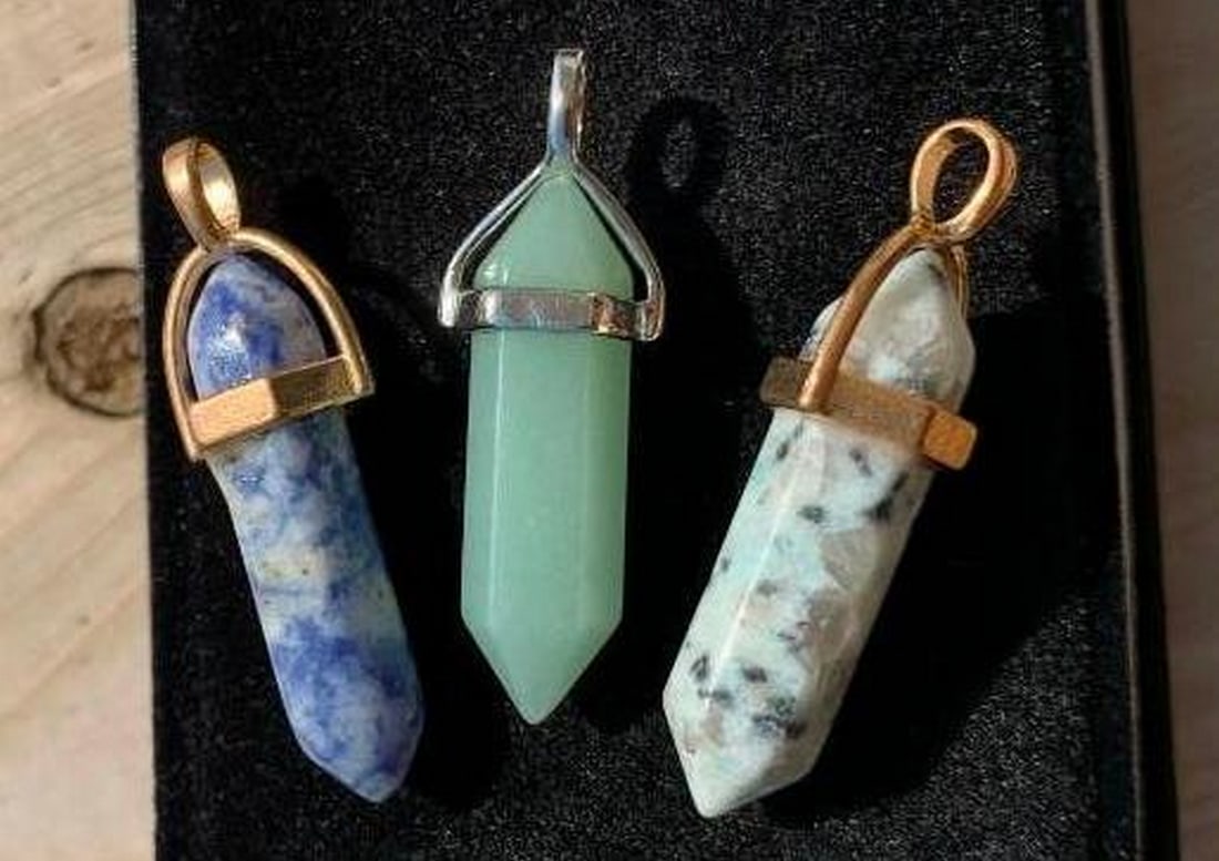 Set of 3 Healing Crystal Pendants in Earthy Tones: Set of 3 Healing Crystal Pendants in Earthy Tones This refreshing set of healing crystal pendants features a soothing mint green stone, a striking blue and white marbled crystal, and a unique piece wi