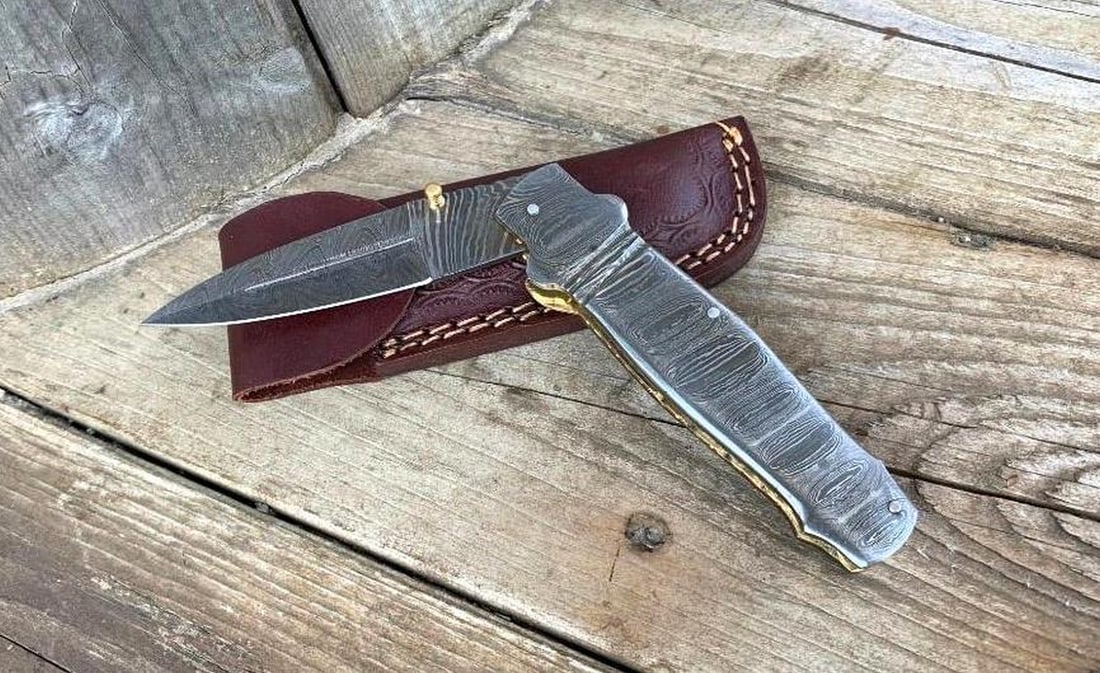 8.5" Storms Reach Folding Damascus Knife: 8.5" Storms Reach Folding Damascus Knife Embark on your outdoor adventures with our Custom Handmade Damascus Steel Hunting, Camping & Folding Knife – a true testament to masterful