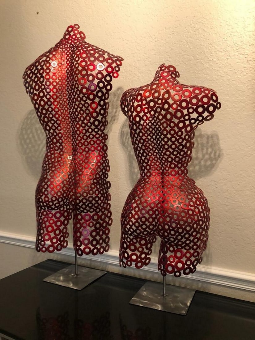 Crimson Unity Metal Sculpture: Crimson Unity Metal Sculpture This striking two-piece metal sculpture captures the harmony of masculine and feminine forms, seamlessly merging into a singular expression of balance and connection.