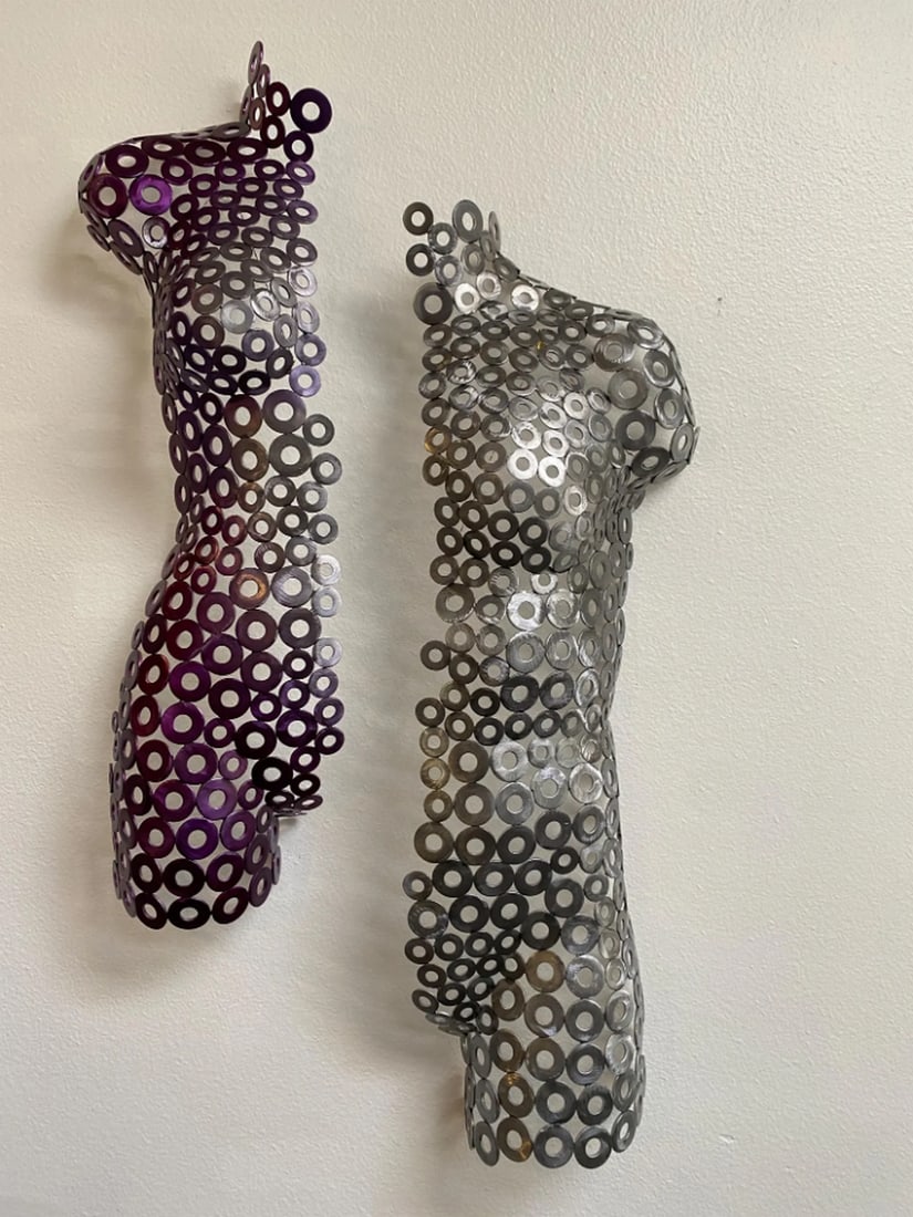 Male and Female Half Torso Wall Art: Male and Female Half Torso Wall Art This striking two-piece metal artwork, featuring a half-male and half-female torso, is hand-formed and welded. Blending metalwork with sculptural form, it exudes ti