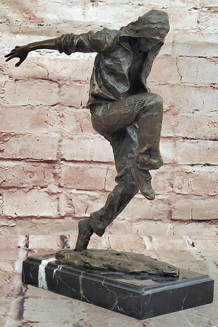 Break Dancer" Original Bronze Sculpture by Mavchi – 12" x 7.5: "Break Dancer" Original Bronze Sculpture by Mavchi – 12" x 7.5" This original bronze sculpture by Mavchi captures the dynamic energy and fluid motion of a break dancer frozen in time