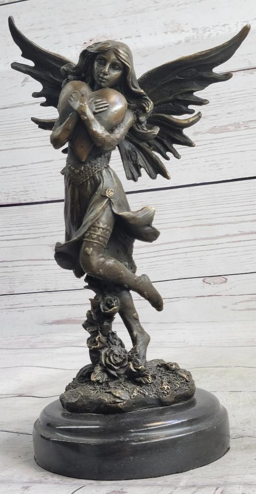 Signed Original Fairy Girl Clutching Heart Bronze Sculpture On Marble Base - 11" x 6": Signed Original Fairy Girl Clutching Heart Bronze Sculpture - 11" x 6" A pretty young fairy clutches a giant heart to her chest. Her wings are spread behind her. She closes her eyes as she dre
