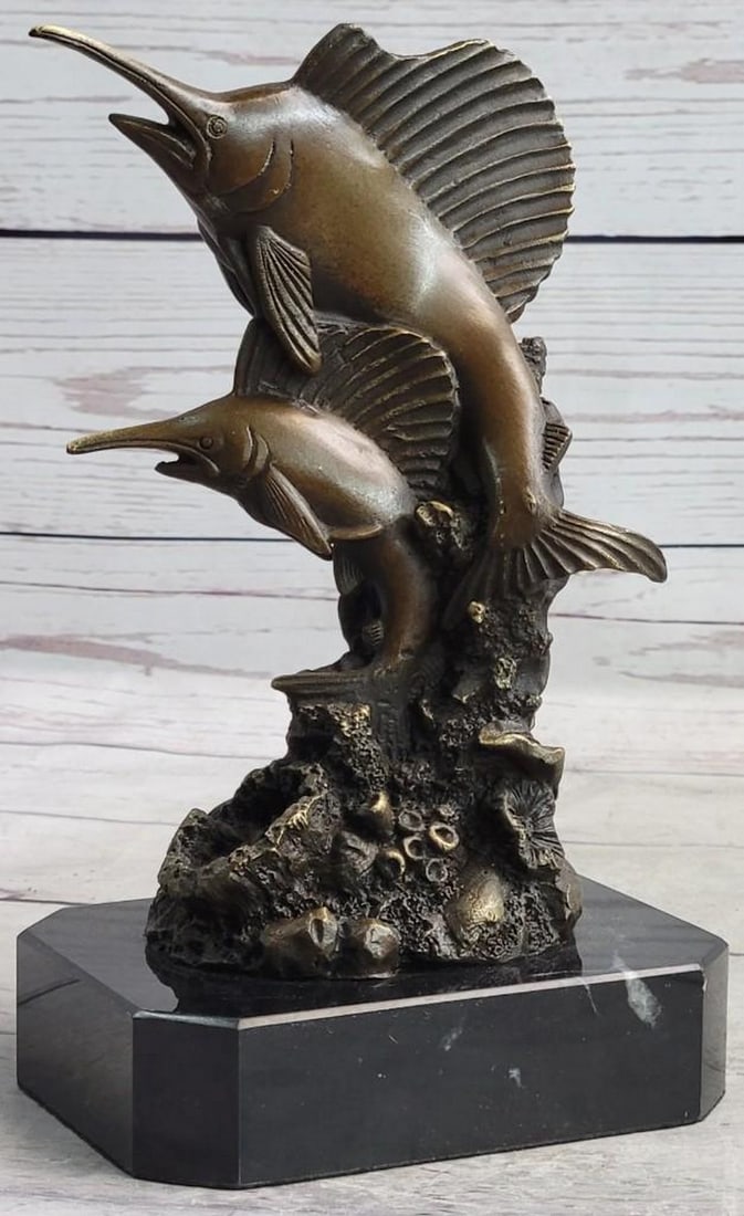 Jumping Marlin Swordfish Bronze Sculpture: Jumping Marlin Swordfish Bronze Sculpture This bronze sculpture captures the dazzling beauty and dynamic shape of a blue marlin as it leaves the surface and is, for a brief moment, airborne. The hope 