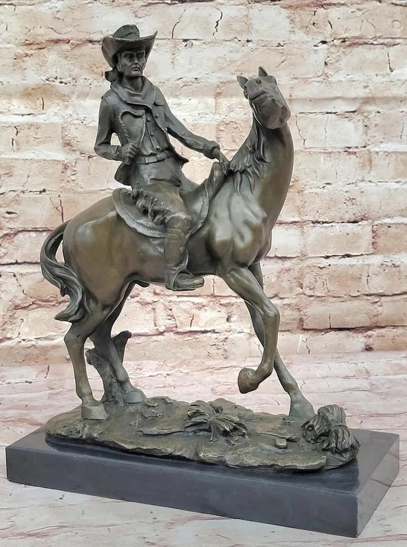 Bronze Western Sculpture Cowboy on Horseback Statue Figure - 14" x 11": Bronze Western Sculpture Cowboy on Horseback Statue Figure - 14" x 11" It's the Wild Wild West! This gunslinger, comfortable on his rearing horse, looks over the horse's neck to watch 