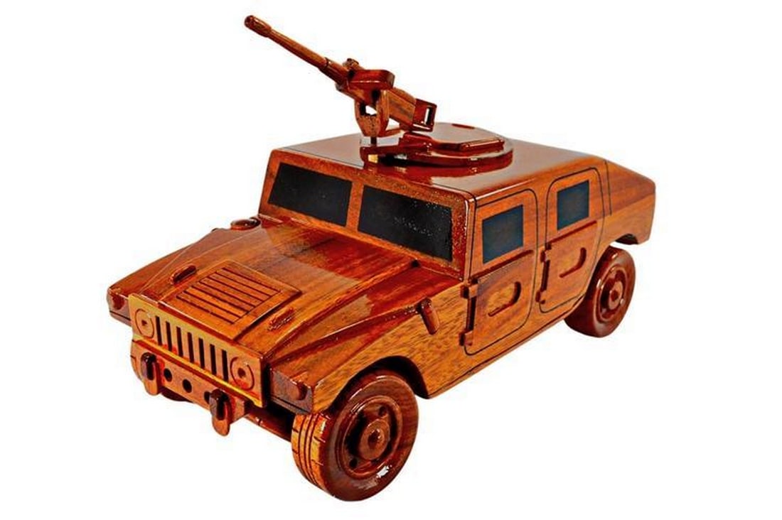 Military Humvee with 50cal Gun Wooden Model: Military Humvee with 50cal Gun Wooden Model Immerse yourself in military history with our meticulously crafted Mahogany Military Humvee replica. Featuring a 50cal machine gun, movable gun mount, and