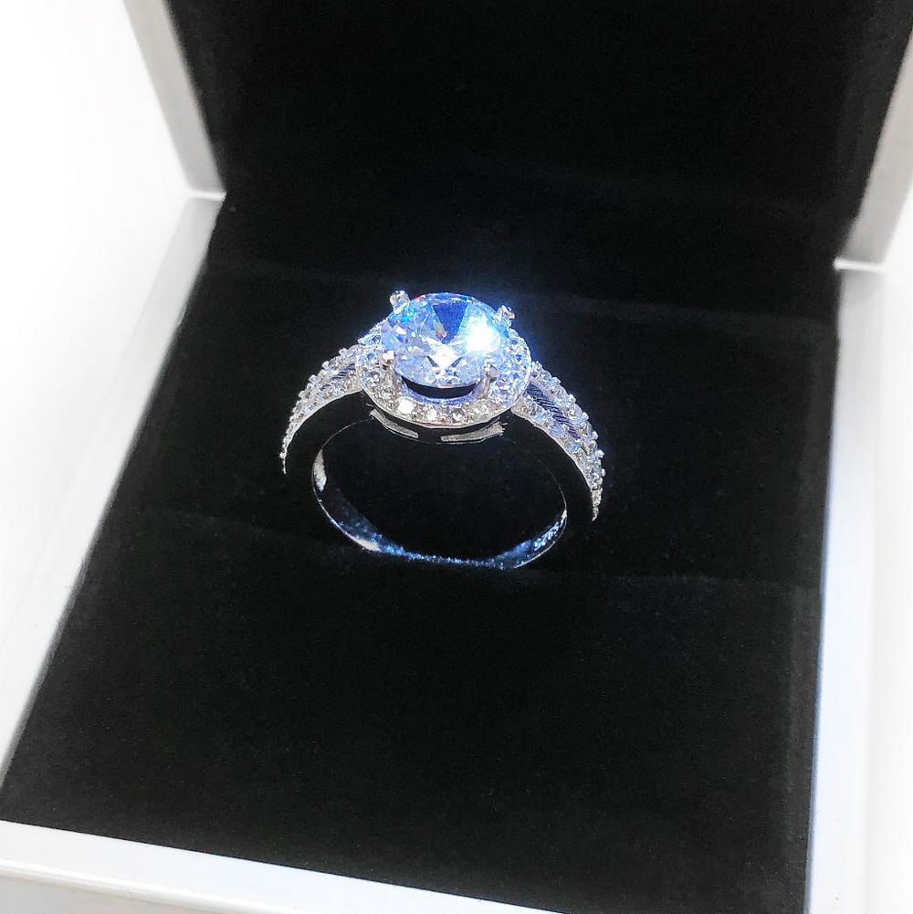 Ladies 925 Silver Marked 2 Carat Main Stone CZ Diamond Ring: A Simple And Beautiful 925 Silver Ring Faceted With A 2 Carat CZ Diamond. Simply Stylish And Beautiful, You Will Never Get Tired Of Wearing This Glamorous Ring. View Photos for Further Details.