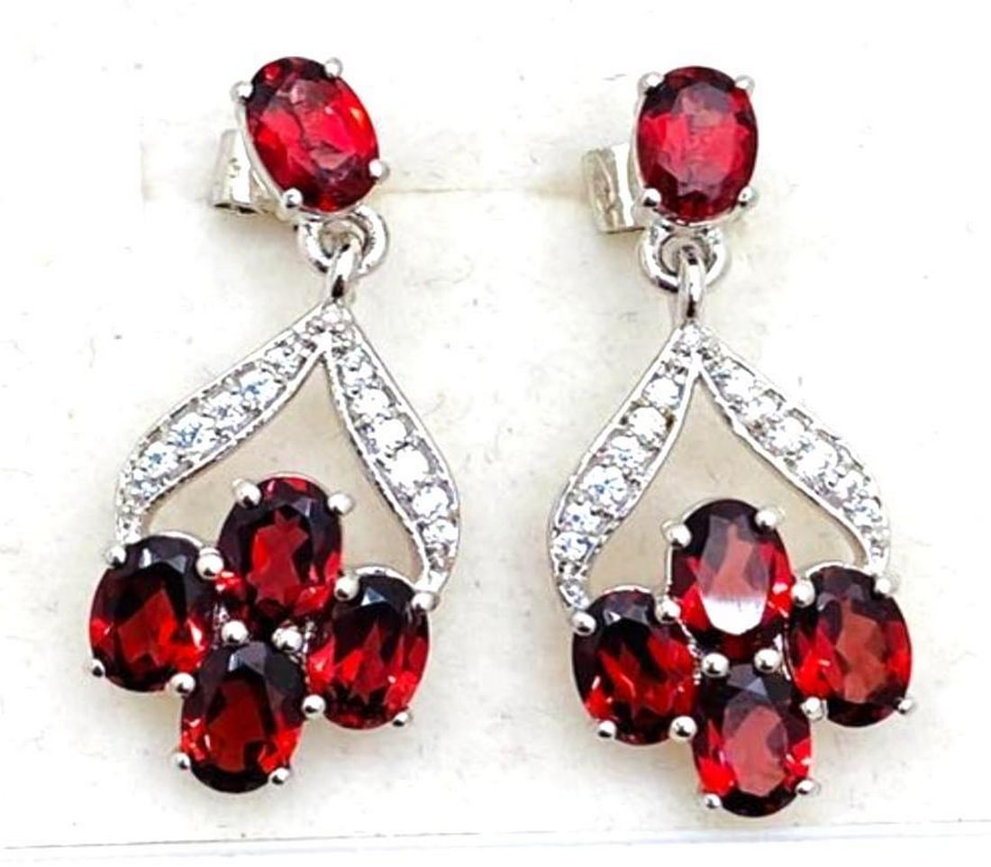 Red Garnet Stone Cluster Dangle Earrings: Red Garnet Stone Cluster Dangle Earrings These ravishing red garnet earrings are 925 Sterling Silver. They feature a cluster of 4 stones dangling from a stone on the front of the stud. View Photos