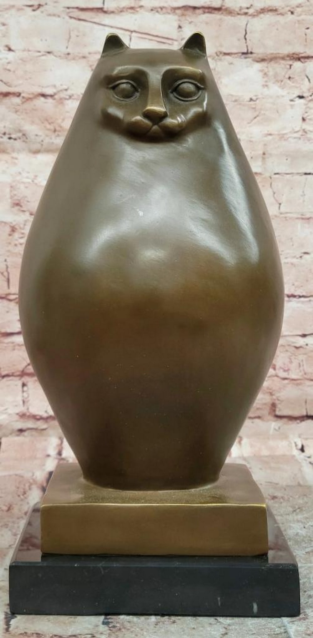 Botero Style Chubby Cat Bronze Sculpture - 13.5" x 6.5": Botero Style Chubby Cat Bronze Sculpture - 13.5" x 6.5" This bronze sculpture features a stylized cat with exaggerated rounded proportions and a smooth, simplified form. The design emphasizes 
