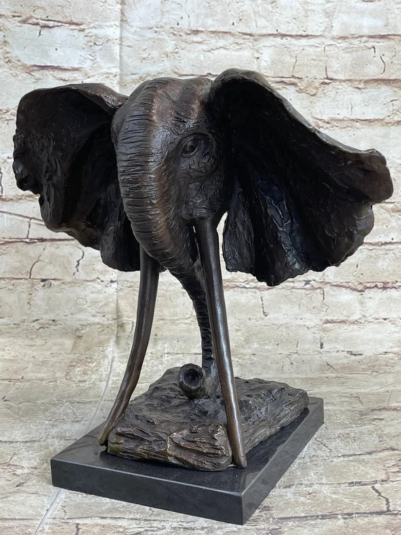 Elephant Bust Bronze Sculpture: Elephant Bust Bronze Sculpture Woah! this is a striking sculpture of the massive elephant. Adding emphasize to the immensity of a real elephant the artist crafted its head much large then the rest of 