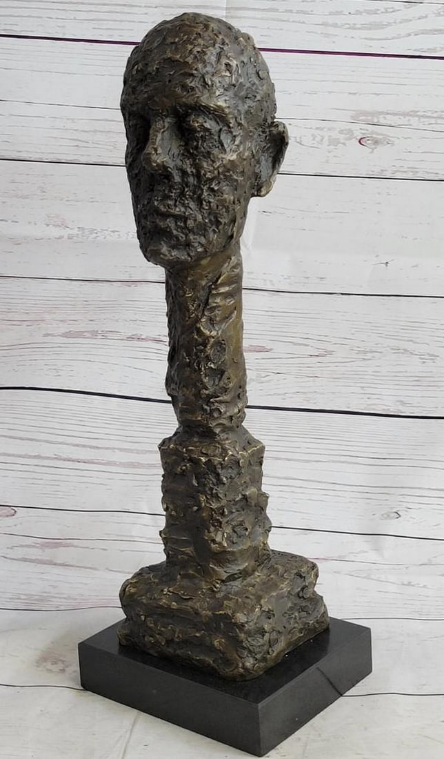 Abstract Bronze Head Face Bust Sculpture Statue On Marble Base - 8lbs (15" x 5"): This unique sculpture is a bit horrifying but at the same time strongly influential. The piece shows a males burnt face, this male has an extended neck that is also burned. Its quiet interesting how t