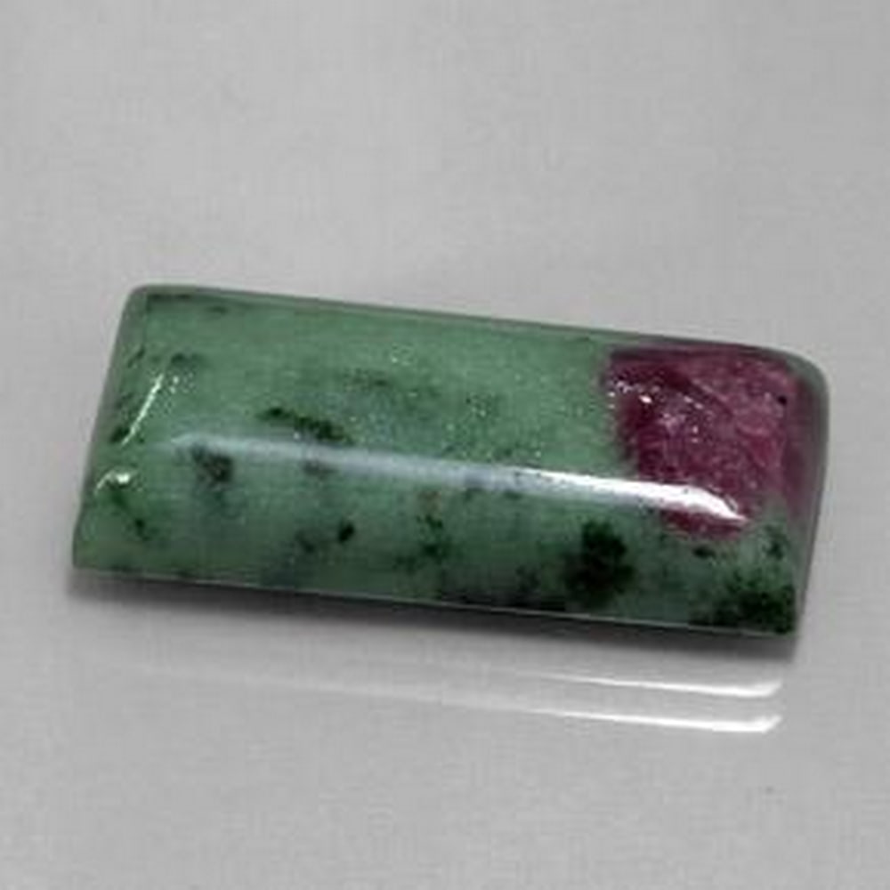 29.97ct Baguette Cabochon Multicolor Ruby-zoisite: 29.97ct Baguette Cabochon Multicolor Ruby-zoisite This incredible baguette would make a very special piece for that special someone. It is said that Zoisite helps return to the self, return to one'