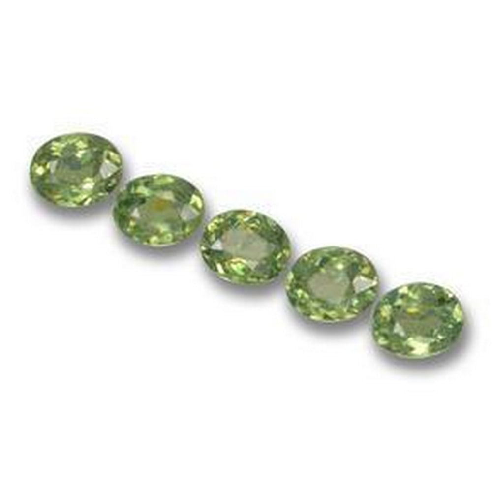 1.34ct Oval Cut Forest Green Demantoid Garnets: 1.34ct Oval Cut Forest Green Demantoid Garnets Lot Contains 5 Gemstones Total Carat Weight: 1.34ct Individual Carat Weight: Approximately 0.26ct Size: 4.3mm x 3.5mm x 2.1mm Shape: Oval Facet Clarity:
