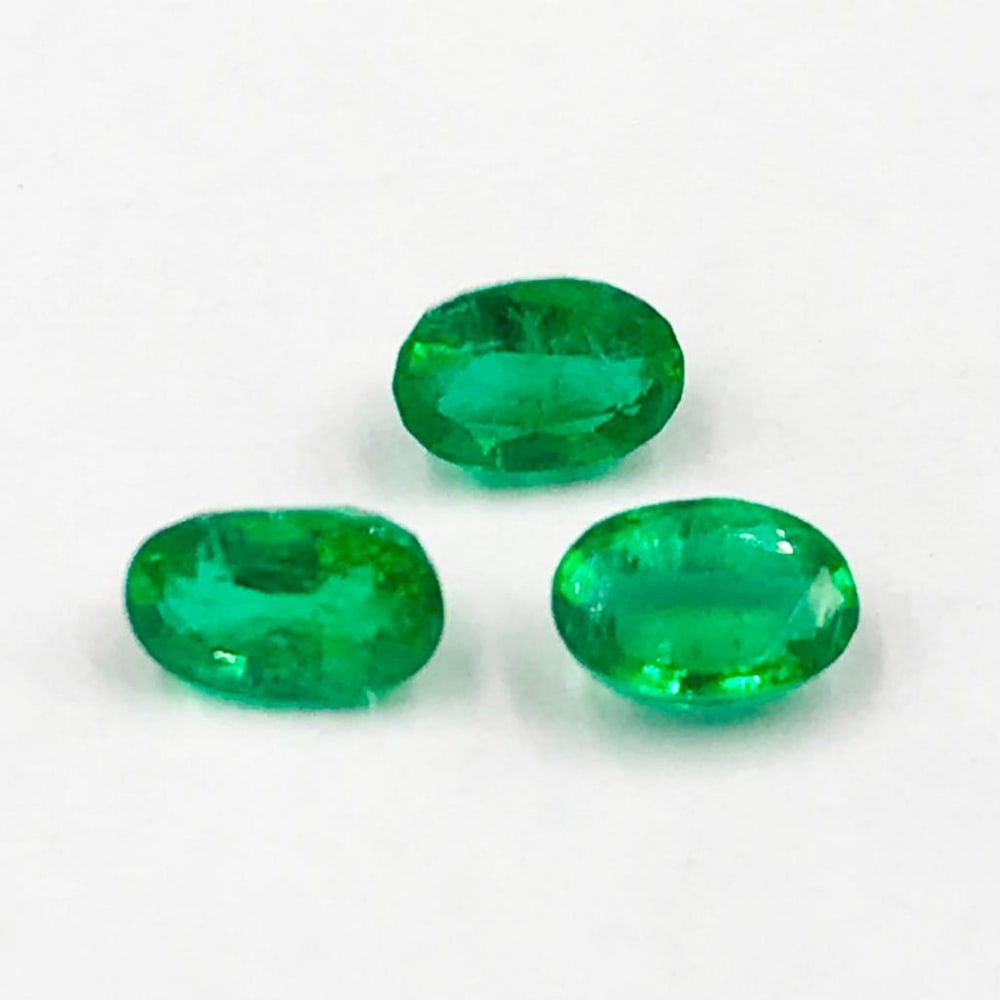 0.84ct Three Oval Shaped Emeralds Gemstones (1 of 1)