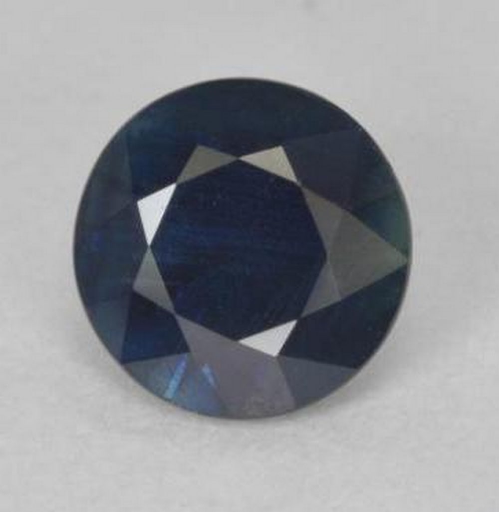 0.85 ct Diamond Cut Midnight Twilight Loose Blue Sapphire Gemstone: 0.85 ct Diamond Cut Midnight Twilight Loose Blue Sapphire Gemstone Introducing our captivating 0.85 ct Diamond Cut Midnight Twilight Loose Blue Sapphire Gemstone—a celestial beauty that captures