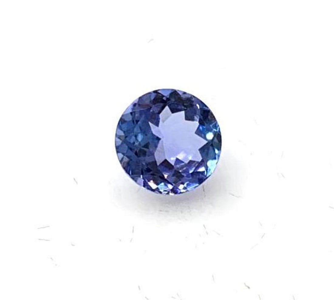 0.65ct Round Faceted Tanzanite Gemstone: Tanzanite is a rare and precious gemstone, which has been coined a 'geographical phenomenon' because of the unusual formation of the stone. The only known source this stone can be found in is