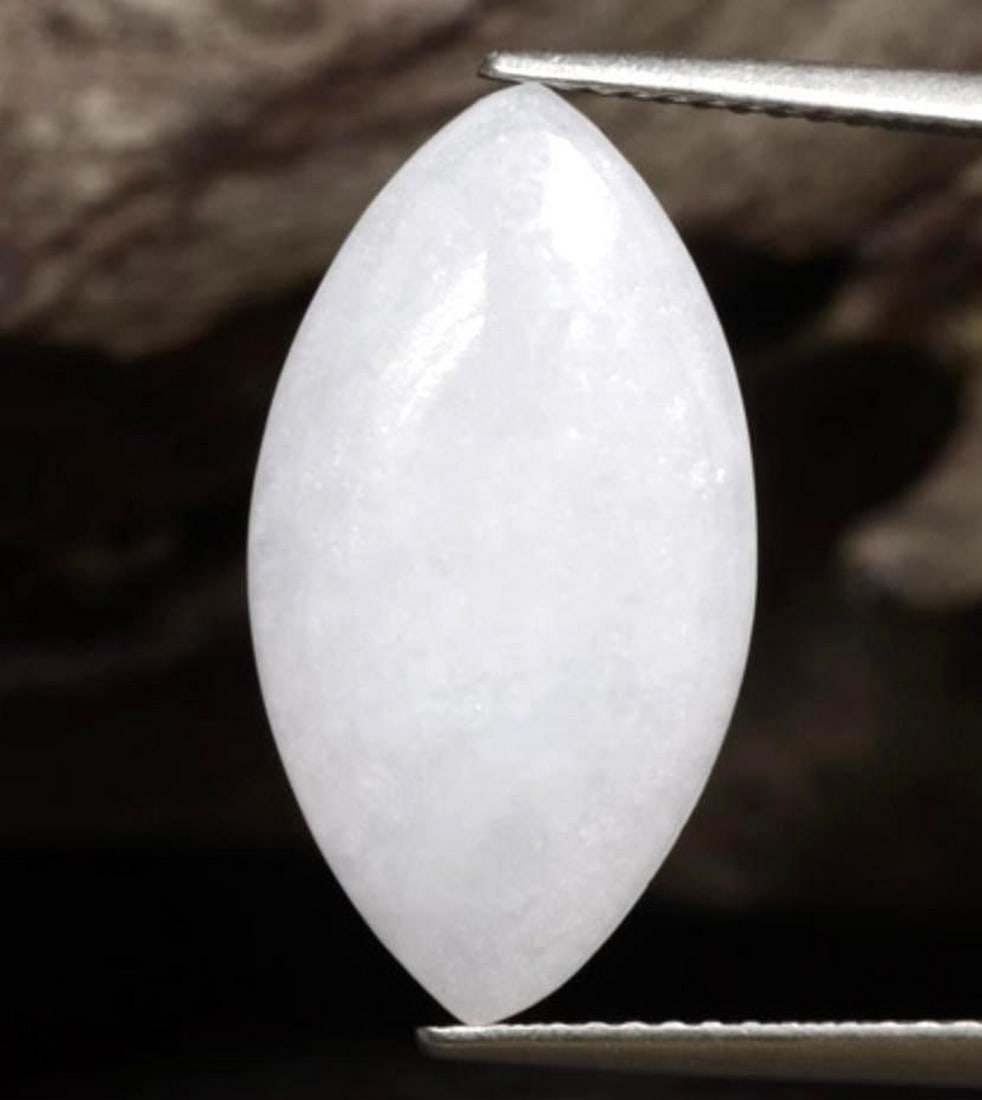 5.25ct Cabochon Cloud Grey-White Jadeite: 5.25ct Cabochon Cloud Grey-White Jadeite Jade symbolism includes associations with nobility and wealth. Many consider it a protector of generations, living and dead. Jade has been and always will be