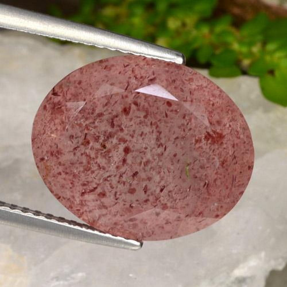 9.98ct Oval Strawberry Speckled Quartz Gemstone: 9.98ct Oval Strawberry Quartz This beautiful gem helps purify one's aura, its energy is strong to keep positive. Helps attract true love or soul mate. It has the ability's to amplifies one'