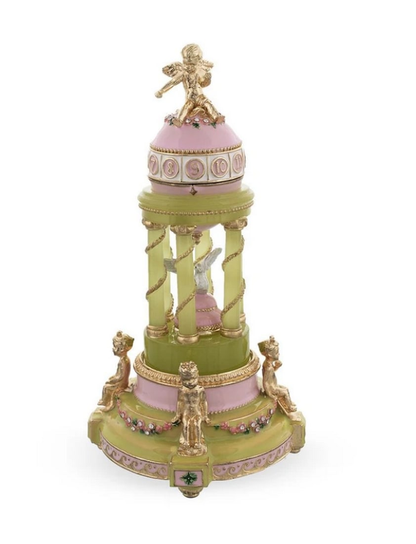 1910 Royal Russian Inspired Egg - The Colonnade Musical: 1910 Royal Russian Inspired Egg - The Colonnade Musical This hand-painted sparkling egg is adorned with a high-polished pink enamel with golden trim. It opens on a hinge and closes shut with a magnet,